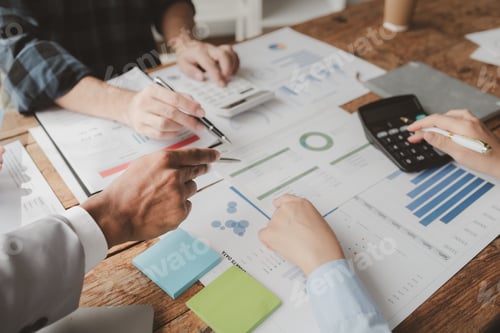 Preview: Business Professionals Reviewing Financial Reports at Office