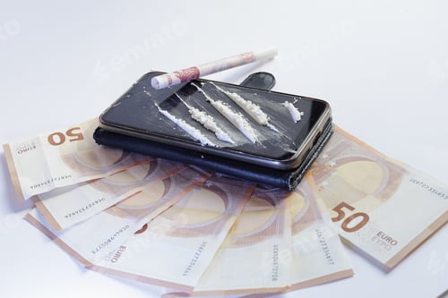 Preview: Banknotes and cocaine on a white background