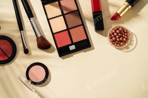 Preview: Make up products at colored background with hard shadows.