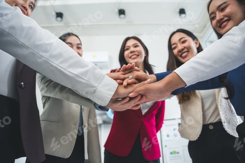Preview: Business team joining hands for teamwork and cooperation success in office
