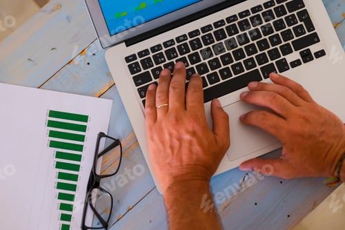 Preview: close up of hands of man on a laptop working hard to create an agency - business man