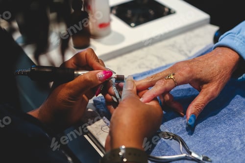Preview: Nail Technician Working on Senior Woman's Manicure