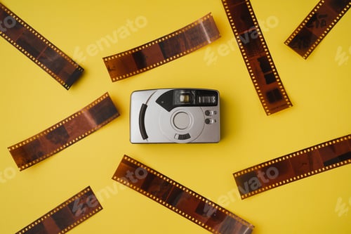 Preview: Film camera on yellow background