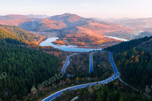 Preview: Flight over the autumn mountains with mountain road serpentine