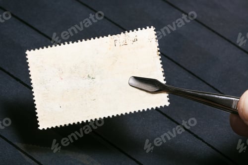 Preview: tongs keeps postage stamp with unused back side