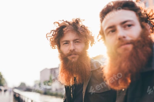 Preview: Two bearded men with curly hair outdoors