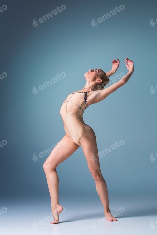 Preview: Young beautiful modern style dancer posing on a studio background