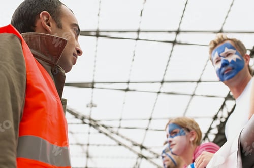 Preview: Steward watching football supporters