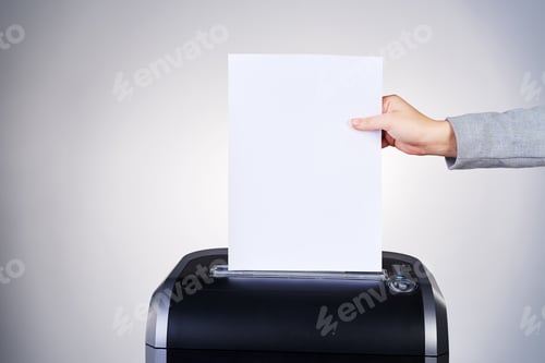 Preview: Just another addition to the paper trail. Studio shot of paper being shredded.