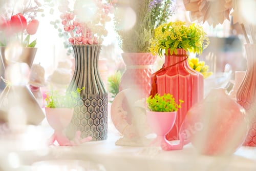 Preview: Vibrant Bouquets in Eclectic Vases on a Sunlit Table at a Springtime Event
