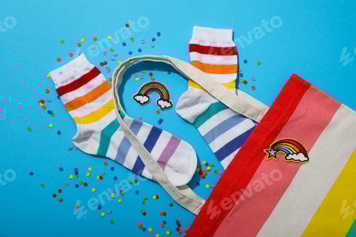 Preview: LGBT parade concept, festive colorful symbols on blue background.