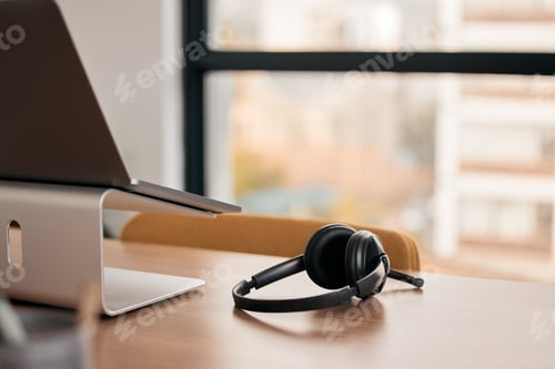Preview: Still life shot of a wireless headset on a desk in a call center