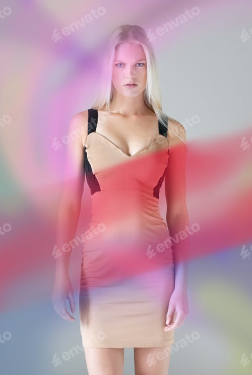 Preview: Portrait of an attractive young female wearing a dress with colours floating around her