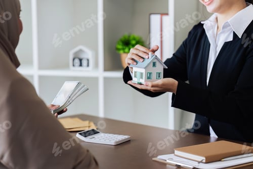 Preview: Real estate agent talk about terms of home purchase agreement and ask the customer to sign document