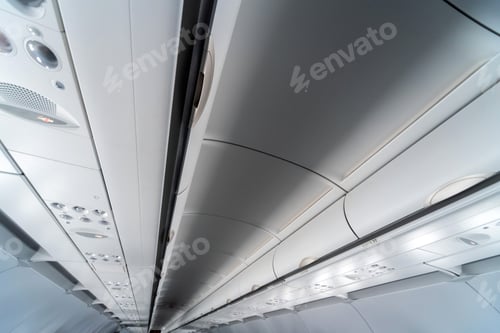 Preview: Airplane air conditioning control panel over seats. Stuffy air in aircraft cabin