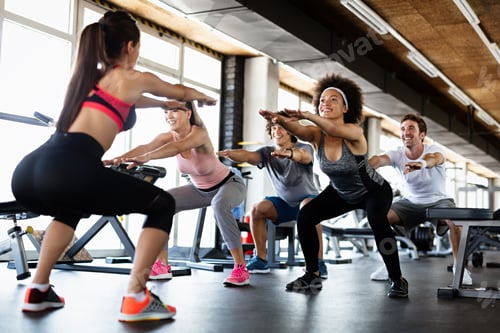 Preview: Group of young people, friends smiling and enjoy sport in gym. People exercise, work out concept.