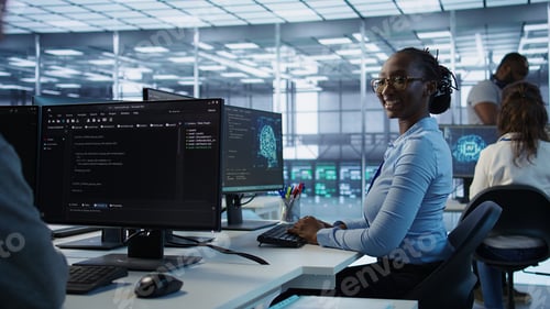 Preview: Portrait of smiling woman tasked with doing checkup on server room