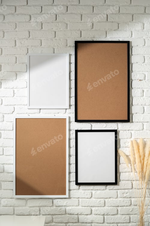 Preview: Varied Sized Photo Frames Displayed on a White Brick Wall