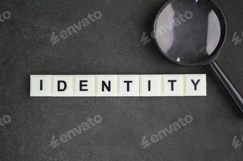 Preview: magnifying glass and letters of the alphabet with the word identity. the fact of being who or what a