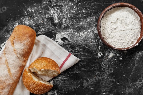 Preview: Fresh bread with bowl of flour on dark background