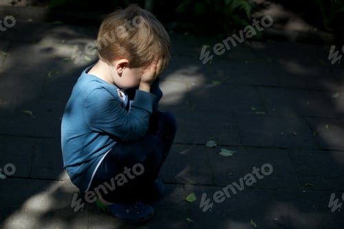 Preview: Autistic boy squatting in the street