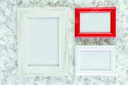 Preview: top view empty photo frames on grey background