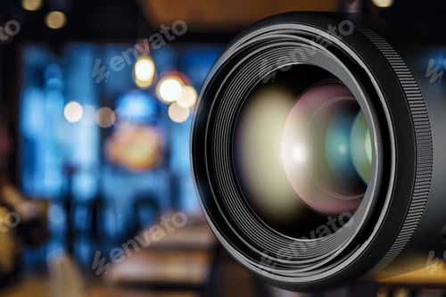 Preview: Camera lens, featuring soft bokeh and blurred cafe background.
