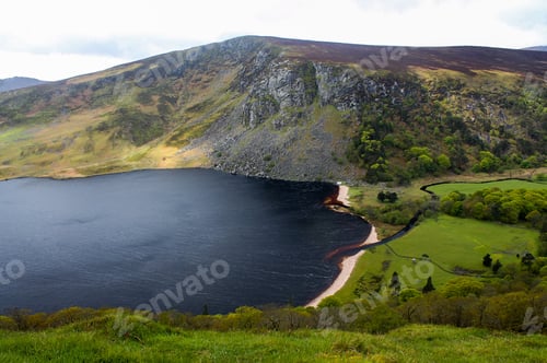 Preview: Aerial shot of Wicklow mountains, with a lake and sky background, Ireland