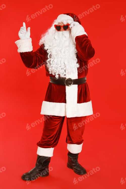 Preview: Authentic Santa Claus wearing sunglasses on red background