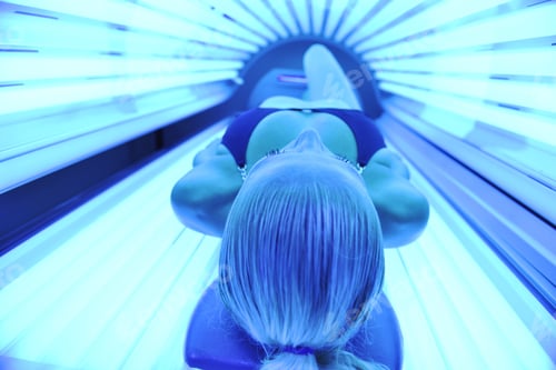 Preview: Young Woman At Laying On Solarium Bed And Get Brown Skin Tone Ready For Summer
