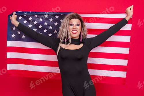 Preview: Happy transgender person raising a north america national flag