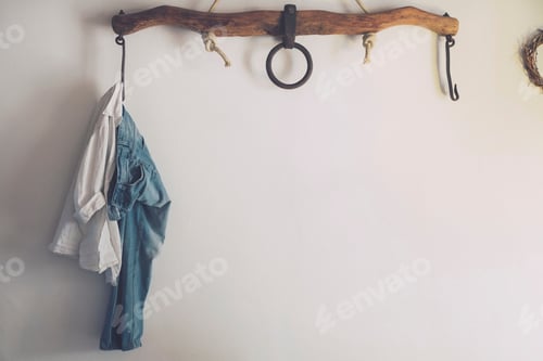 Preview: Casual Clothes Hanging on Rustic Wooden Rack