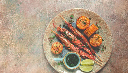 Preview: langoustines on skewers, shrimp kebab, with fried corn, spices and herbs, homemade, no people,