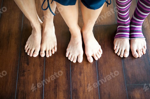 Preview: Three women standing on wooden floor