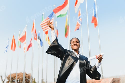 Preview: cheerful african american graduate student with diploma in her hand