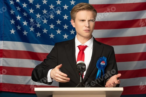 Preview: emotional man on tribune during speech on american flag background