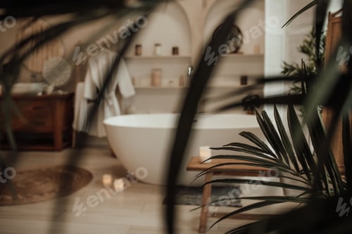 Preview: Luxury interior of big bathroom at modern african style with oval bathtub in natural lighting