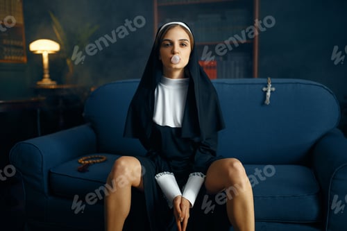 Preview: Nun in a cassock sitting spreading her legs