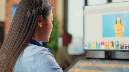 Preview: Woman freelancer using retouching software on computer