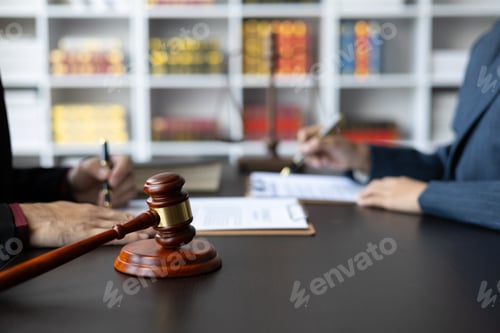 Preview: Businessman and lawyer discuss with legal advisor in lawyer's law office.