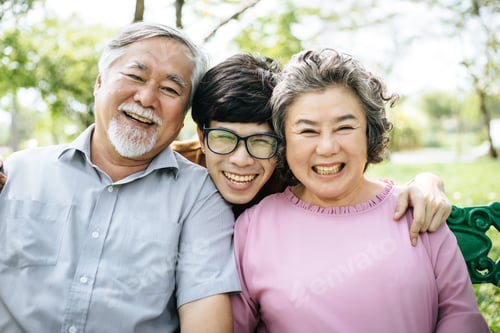 Preview: Happy family having fun outdoors and smiling