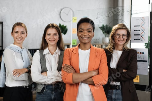 Preview: Close up portrait of female economists in formal wear looking at camera while standing together