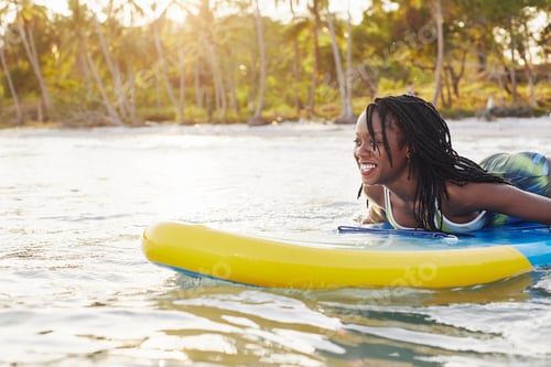 Preview: Woman swimming on sup board