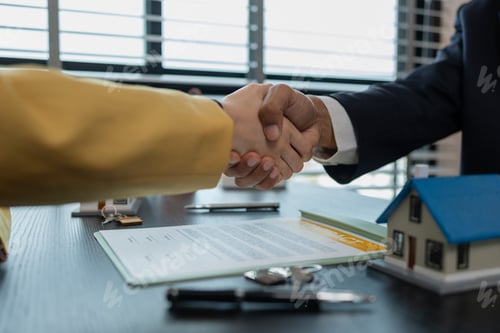 Preview: they shake hands after the home purchase contract is approved