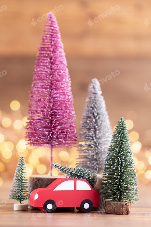 Preview: Colorful Christmas tree on wooden, bokeh background.