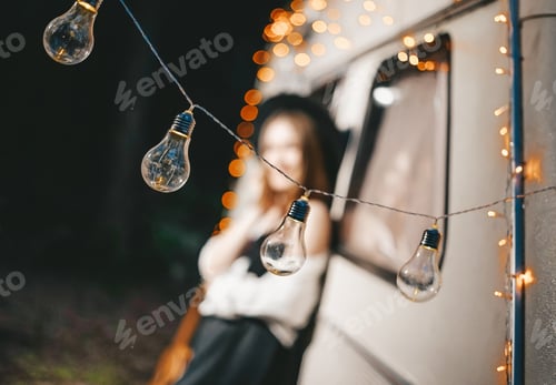 Preview: Garland of light bulbs on camper background