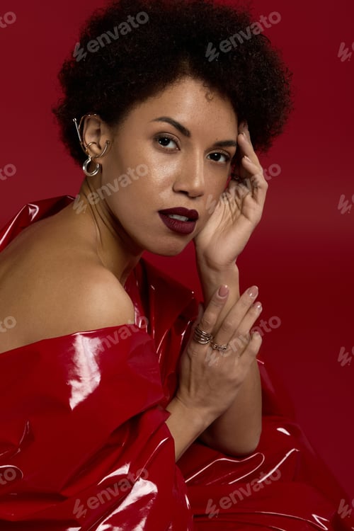 Preview: Elegant young fashionista showcasing style and beauty in striking red