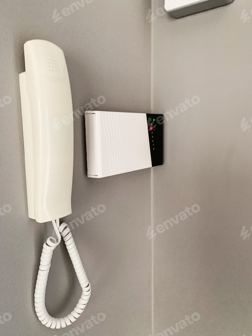 Preview: Intercom and alarm on gray wall at home