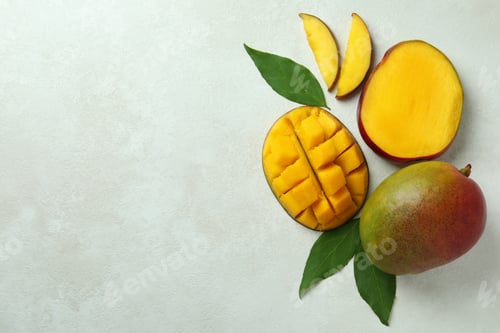 Preview: Tasty ripe mango fruit on white textured background