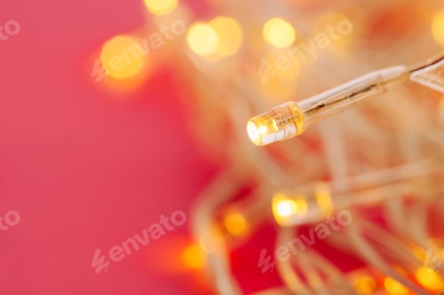 Preview: Illuminated garland lights on bright pink background